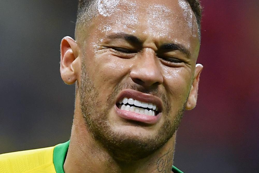 Brazil's forward Neymar reacts during the Russia 2018 World Cup quarter-final football match between Brazil and Belgium at the Kazan Arena in Kazan on July 6, 2018. RESTRICTED TO EDITORIAL USE - NO MOBILE PUSH ALERTS/DOWNLOADS

 / AFP / Manan VATSYAYANA / RESTRICTED TO EDITORIAL USE - NO MOBILE PUSH ALERTS/DOWNLOADS

