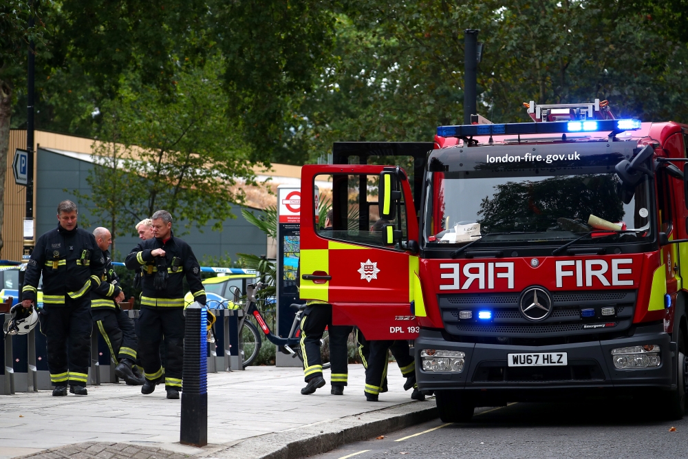 Fire fighters attend the scene after a car crashed outside the Houses of Parliament in Westminster, London, Britain, August 14, 2018. REUTERS/Hannah McKay