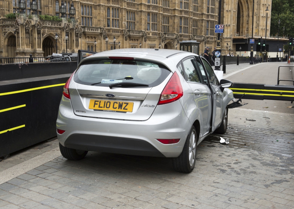 The car that was driven at pedestrians and cyclists in Westminster then crashed into the barrier outside the Houses of Parliament on Tuesday is seen in an image handed out by the Metropolitan Police in London, August 15, 2018. Metropolitan Police handout via REUTERS