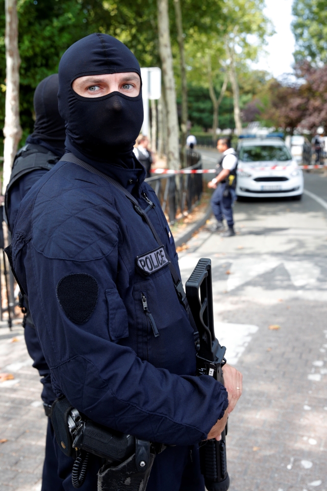 French police secure a street after a man killed two persons and injured an other in a knife attack in Trappes, near Paris, according to French authorities, France, August 23, 2018. REUTERS/Philippe Wojazer