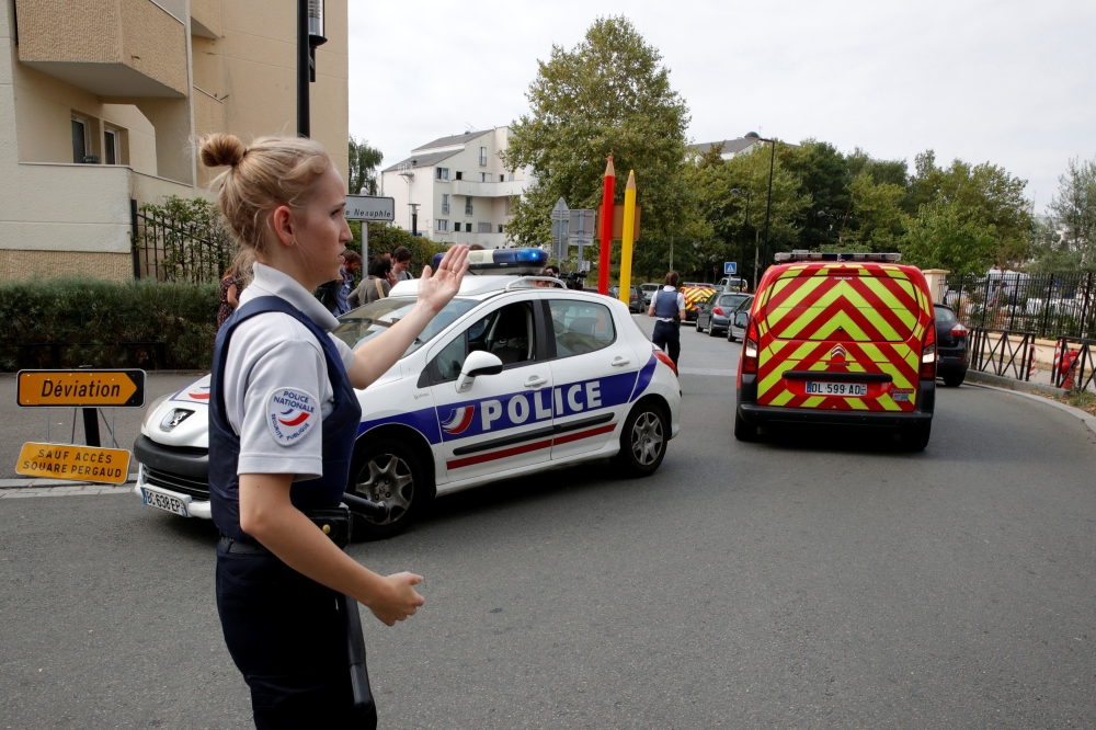 French police secure a street after a man killed two persons and injured an other in a knife attack in Trappes, near Paris, according to French authorities, France, August 23, 2018. REUTERS/Philippe Wojazer