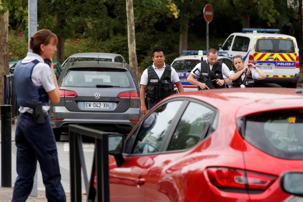 French police secure a street after a man killed two persons and injured an other in a knife attack in Trappes, near Paris, according to French authorities, France, August 23, 2018. REUTERS/Philippe Wojazer