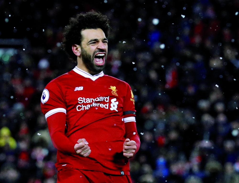 Soccer Football - Premier League - Liverpool vs Watford - Anfield, Liverpool, Britain - March 17, 2018   Liverpool's Mohamed Salah celebrates scoring their fourth goal   REUTERS/Phil Noble    EDITORIAL USE ONLY. No use with unauthorized audio, video, data, fixture lists, club/league logos or 