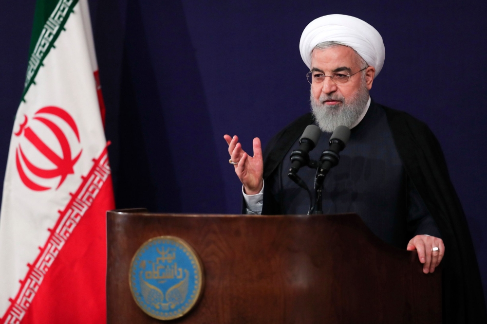 A handout picture provided by the office of Iranian President Hassan Rouhani on October 14, 2018 shows him giving a speech during a ceremony at Tehran University marking the beginning of the new Iranian academic year. - == RESTRICTED TO EDITORIAL USE - MANDATORY CREDIT «AFP PHOTO / HO / IRANIAN PRESIDENCY» - NO MARKETING NO ADVERTISING CAMPAIGNS - DISTRIBUTED AS A SERVICE TO CLIENTS == / AFP / IRANIAN PRESIDENCY / STRINGER / == RESTRICTED TO EDITORIAL USE - MANDATORY CREDIT «AFP PHOTO / HO / IRANIAN PRESIDENCY» - NO MARKETING NO ADVERTISING CAMPAIGNS - DISTRIBUTED AS A SERVICE TO CLIENTS == 