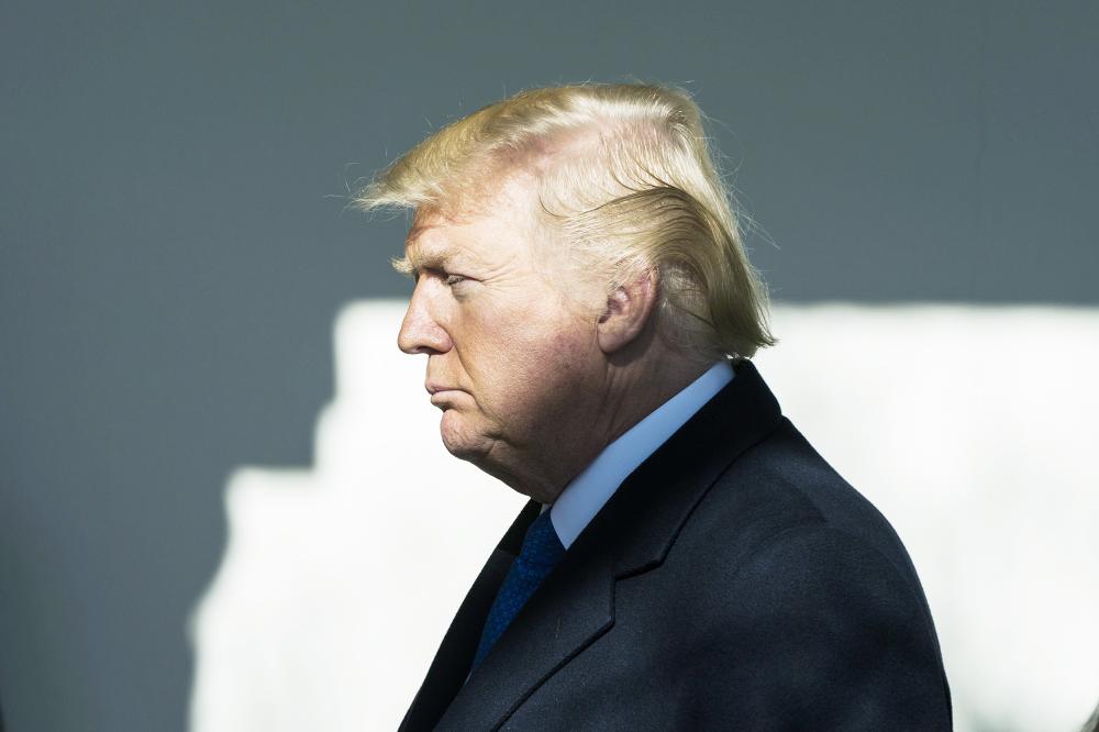 epa06454763 US President Donald J. Trump prepares to address March for Life Participants and Pro-Life Leaders via teleconference from the Rose Garden of the White House in Washington, DC, USA 19 January 2018. The federal government is heading for a shutdown at midnight; the White House said the President will no longer leave for Florida unless Congress reaches a spending deal. EPA/JIM LO SCALZO