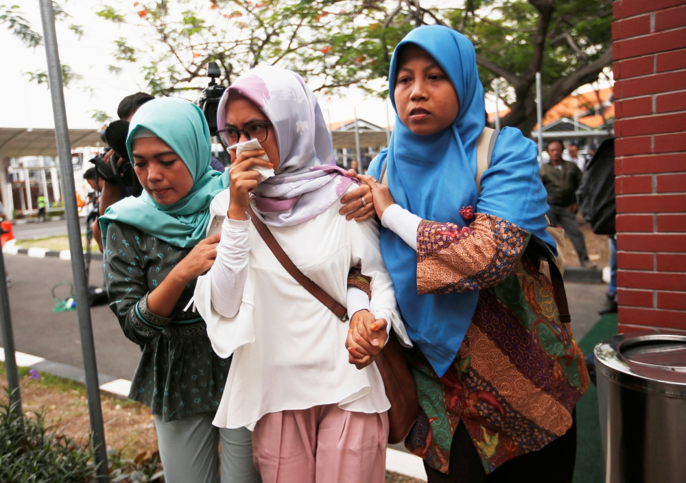 Relatives of passengers of Lion Air flight JT610 that crashed into the sea, arrive at crisis center at Soekarno Hatta International airport near Jakarta, Indonesia, October 29, 2018. REUTERS/Willy Kurniawan