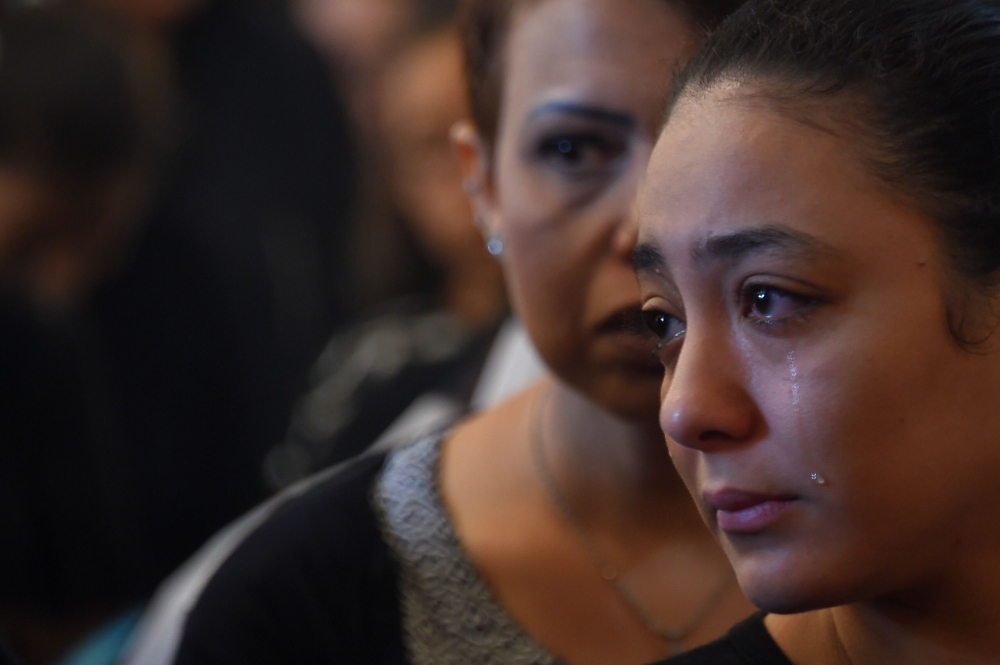 An Coptic Christian woman mourns victims killed in an attack a day earlier, during an early morning ceremony at the Prince Tadros church in Egypt's southern Minya province, on November 3, 2018. Gunmen attacked a bus carrying Coptic Christians in central Egypt yesterday, killing seven in the latest assault on the religious minority claimed by the Islamic State (IS) group.
The attackers opened fire on the bus of pilgrims in Minya province after the occupants had visited the Saint Samuel monastery, the local bishop told AFP. / AFP / MOHAMED EL-SHAHED 