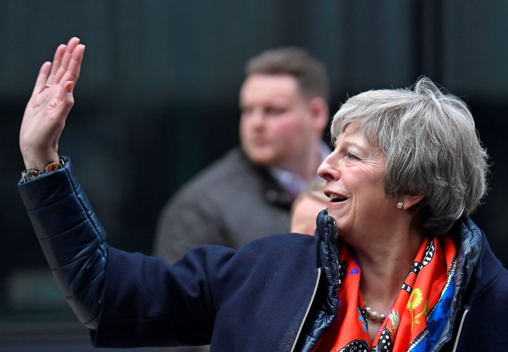 Britain's Prime Minister Theresa May leaves the BBC, after taking part in a live radio phone-in, in central London, Britain, November 23, 2018. REUTERS/Toby Melville