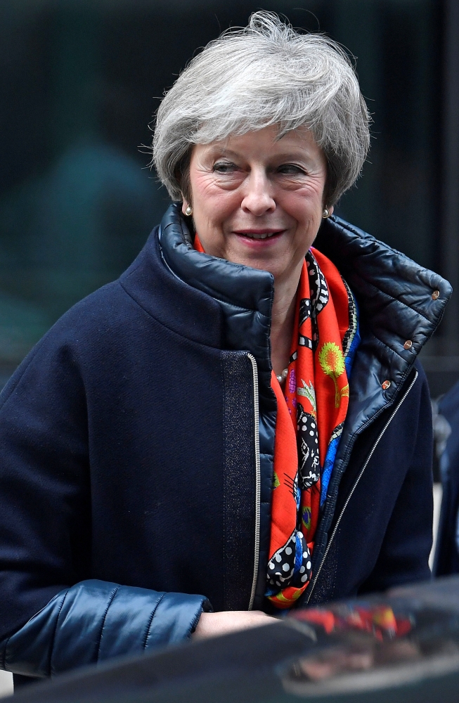 Britain's Prime Minister Theresa May leaves the BBC, after taking part in a live radio phone-in, in central London, Britain, November 23, 2018. REUTERS/Toby Melville