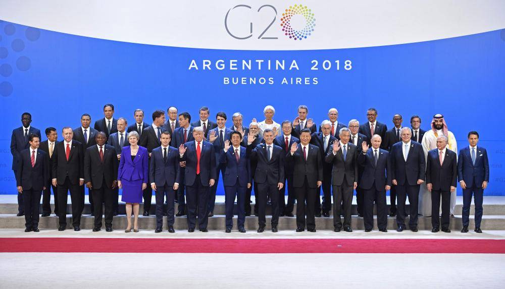 Participants of the G20 Leaders' Summit in Buenos Aires, pose for the family photo on November 30, 2018.  Global leaders gather in the Argentine capital for a two-day G20 summit likely to be dominated by simmering international tensions over trade. / AFP / Alexander NEMENOV
