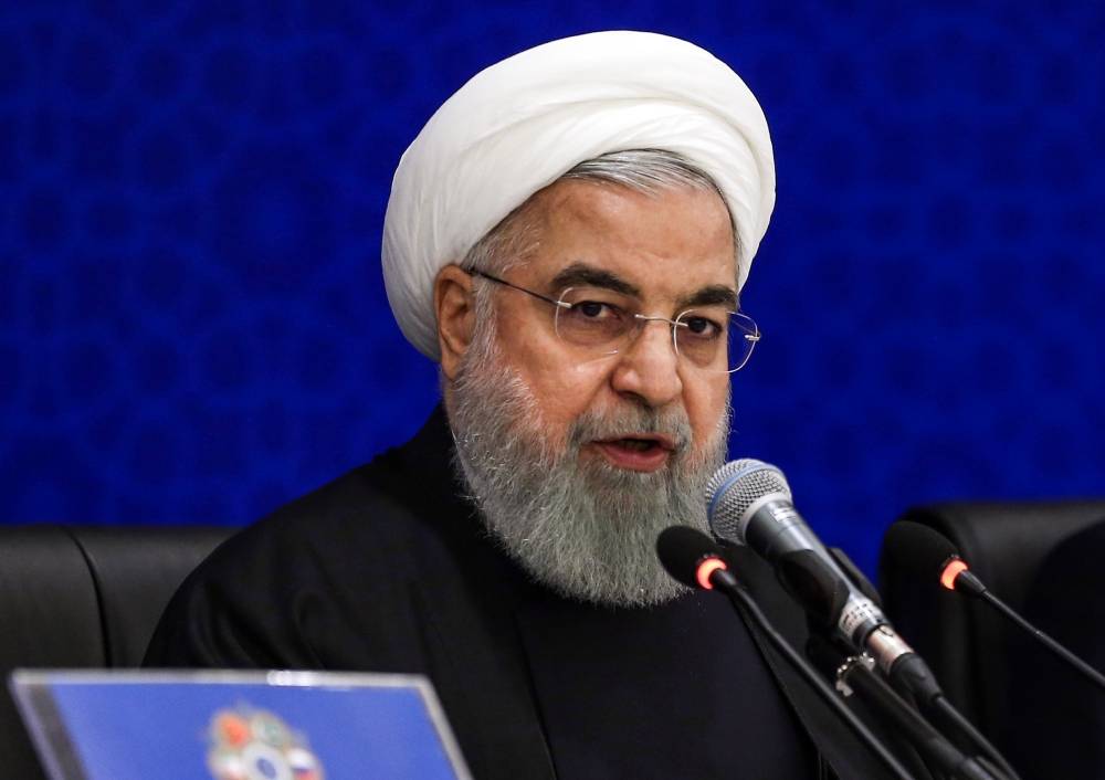 Iranian President Hassan Rouhani (C) speaks during the 2nd Speaker's Conference, which includes delegations from Afghanistan, China, Pakistan, Turkey and focuses on terrorism and regional cooperation, in the capital Tehrnan on December 8, 2018. Rouhani said US sanctions were «economic terrorism», as he sought to foster a united front from visiting regional officials on December 8. Addressing parliament speakers from Afghanistan, China, Pakistan, Russia and Turkey, Rouhani said they had all suffered economic pressure from the US. / AFP / afp / - 