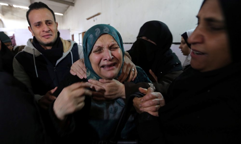 The mother of Palestinian man Karam Fayyad mourns during his funeral in the southern Gaza Strip December 29, 2018. REUTERS/Ibraheem Abu Mustafa