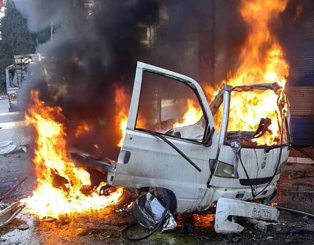 This handout image made available by the official Syrian Arab News Agency (SANA)'s Telegram page on January 22, 2019, shows a burning vehicle in the Syrian regime's coastal stronghold of Latakia. A car bomb exploded today in Latakia, killing one person and wounding four others, state news agency SANA reported. 