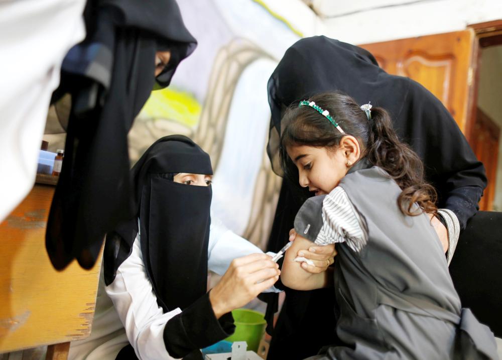 A girl receives a vaccination for measles and rubella at her school as a six-day immunization campaign kicks off in Sanaa, Yemen February 9, 2019. REUTERS/Khaled Abdullah