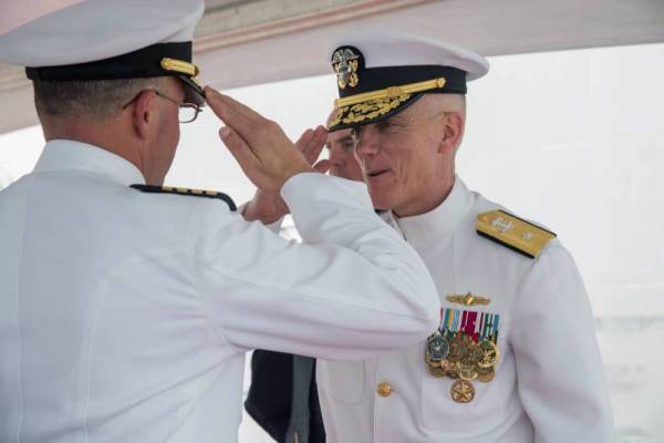 U.S. Navy Rear Admiral Jim Malloy (R), commander of Carrier Strike Group 10, is saluted during a change of command ceremony onboard the USS Dwight D. Eisenhower during deployment in Norfolk, Viginia, U.S., in this undated photo. U.S. Navy/Handout via REUTERS ATTENTION EDITORS - THIS IMAGE WAS PROVIDED BY A THIRD PARTY.