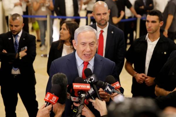 Israeli Prime Minister Benjamin Netanyahu talks to the press following a vote on a bill to dissolve the Knesset (Israeli parliament) on May 29, 2019, at the Knesset in Jerusalem. Parliament voted 74-45 in favour of dissolving itself and setting elections for September 17. / AFP / Menahem KAHANA 