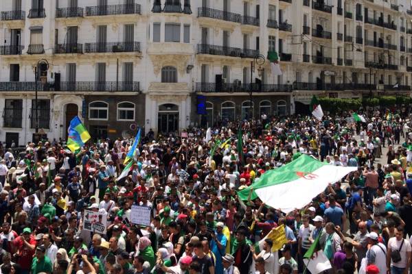 Demonstrators carry banners and flags during a protest demanding the removal of the ruling elite in Algiers, Algeria June 7, 2019. REUTERS/Ramzi Boudina