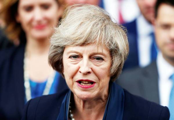 FILE PHOTO: Theresa May speaks to reporters after being confirmed as the leader of the Conservative Party and Britain's next Prime Minister  outside the Houses of Parliament in Westminster, central London, July 11, 2016. REUTERS/Neil Hall/File Photo