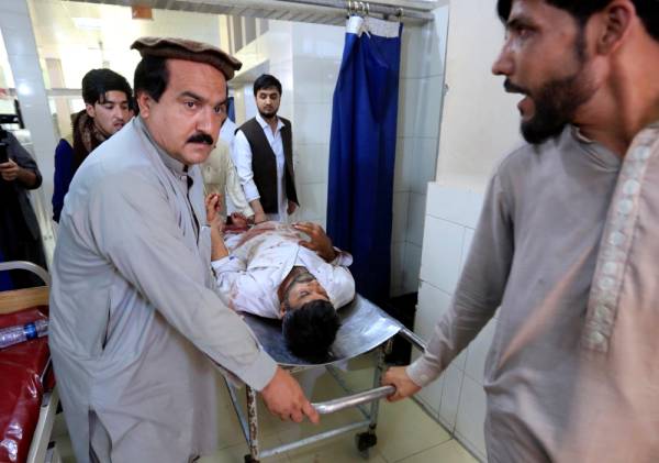 ATTENTION EDITORS - VISUAL COVERAGE OF SCENES OF INJURY OR DEATH Afghan men carry a wounded person to the hospital after a suicide attack in Jalalabad, Afghanistan, June 13, 2019. REUTERS/Parwiz