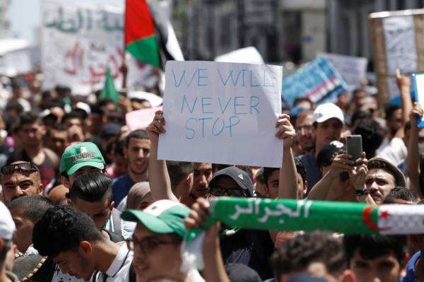 Students carry banners and flags during an anti-government protest in Algiers, Algeria June 18, 2019. REUTERS/Ramzi Boudina