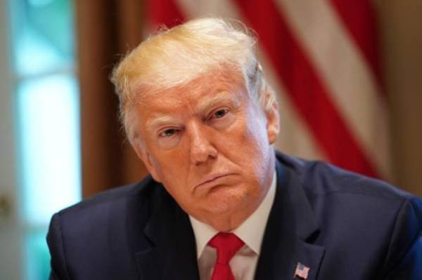 US President Donald Trump listens during a working lunch with governors on workforce freedom and mobility in the Cabinet Room of the White House in Washington, DC on June 13, 2019. / AFP / MANDEL NGAN 