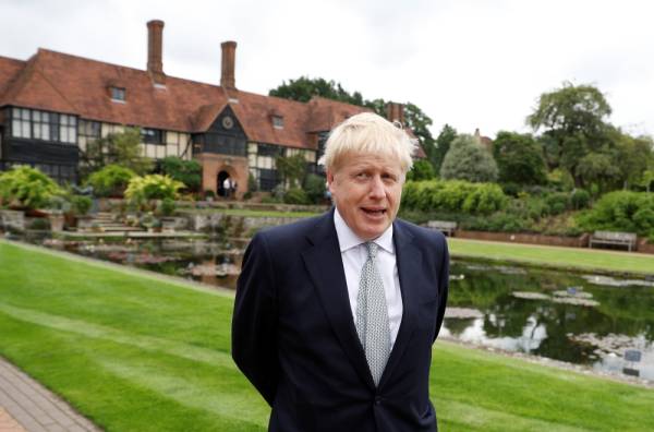 Boris Johnson, a leadership candidate for Britain's Conservative Party, looks on during his visit at Wisley Garden Centre in Surrey, Britain, June 25, 2019. REUTERS/Peter Nicholls