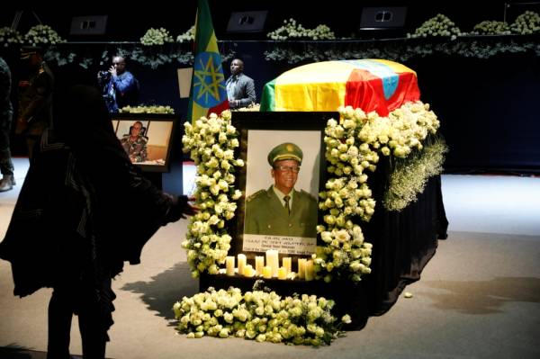 A mourner stands in front of the coffin of Army Chief of Staff Seare Mekonnen, who was shot by his bodyguard, during a memorial ceremony in Addis Ababa, Ethiopia June 25, 2019. REUTERS/Baz Ratner    NO RESALES. NO ARCHIVES.