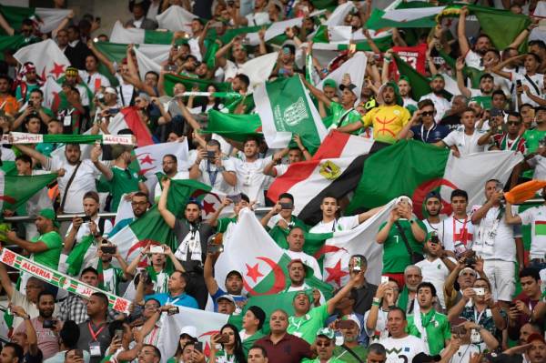 Algeria fans cheer ahead of the 2019 Africa Cup of Nations (CAN) football match between Kenya and Tanzania at the June 30 Stadium in Cairo on June 27, 2019.  / AFP / Khaled DESOUKI
