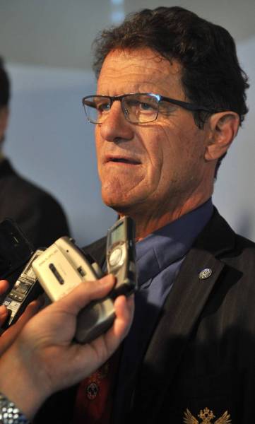 Russia's coach Italian Fabio Capello speaks to the press after the Brazil 2014 FIFA World Cup groups-stage draw, in Costa do Sauipe, Bahia state, Brazil, on December 6, 2013.  AFP PHOTO / NELSON ALMEIDA
