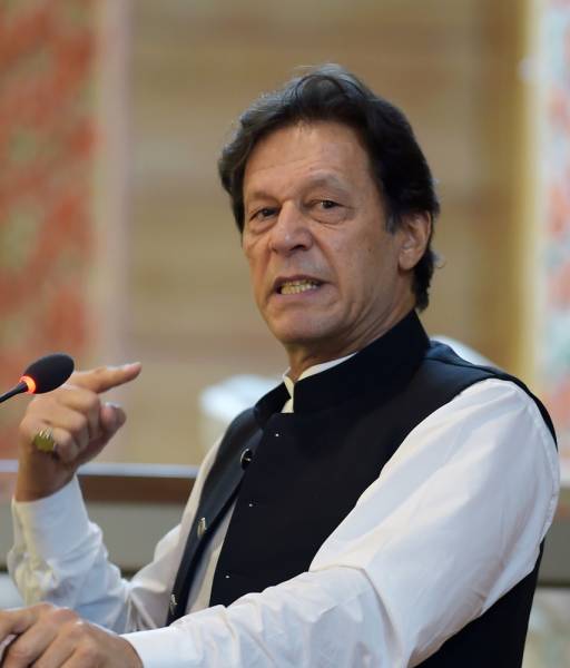 Pakistan's Prime Minister Imran Khan addresses the legislative assembly in Muzaffarabad, the capital of Pakistan-controlled Kashmir on August 14, 2019, to mark the country's Independence Day. His visit to mark the country's Independence Day comes more than a week after Indian Prime Minister Narendra Modi delivered a surprise executive decree to strip its portion of the Muslim-majority Himalayan region of its special status. / AFP / AAMIR QURESHI 