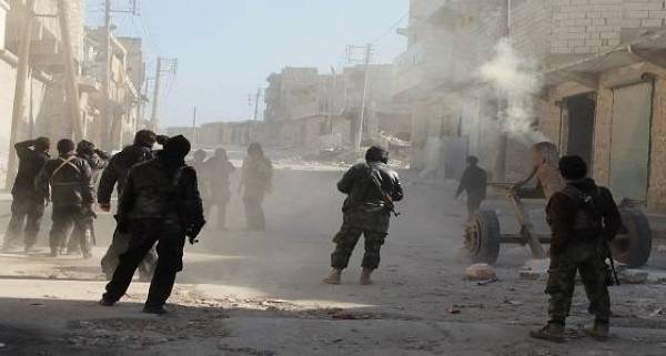 Members of the jihadist group Al-Nusra Front fire homemade mortar rounds during fighting with goverment forces on February 8, 2014 in the Syrian village of Aziza, on the southern outskirts of Aleppo. New aerial bombardment from explosives-packed barrel bombs in the northern Syrian city of Aleppo killed at least 20 people, the Syrian Observatory for Human Rights said. AFP PHOTO / BARAA AL-HALABI        (Photo credit should read BARAA AL-HALABI/AFP/Getty Images)