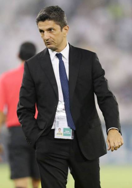 Hilal's coach Razvan Lucescu looks on during the first leg of the AFC Champions League semi-finals football match between Qatar's Al Sadd and Saudi' Al Hilal at the Jassim bin Hamad Stadium in the Qatari capital Doha, on October 1, 2019. / AFP / Karim JAAFAR