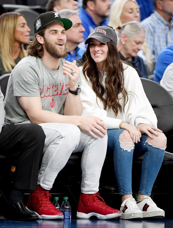 LAS VEGAS, NEVADA - DECEMBER 21: Philadelphia Phillies outfielder Bryce Harper (L) and his wife Kayla Harper attend a game between the Ohio State Buckeyes and the Kentucky Wildcats during the CBS Sports Classic at T-Mobile Arena on December 21, 2019 in Las Vegas, Nevada. The Buckeyes defeated the Wildcats 71-65. Ethan Miller/Getty Images/AFP
== FOR NEWSPAPERS, INTERNET, TELCOS & TELEVISION USE ONLY ==
