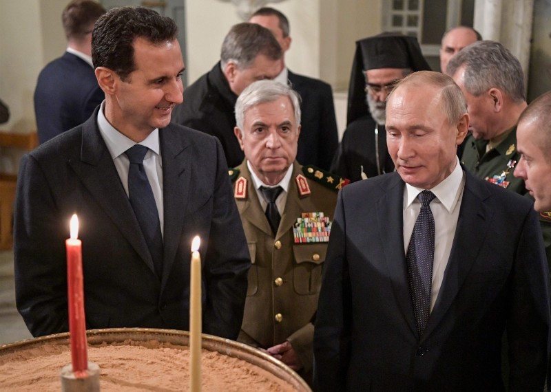 A handout picture released by the official Syrian presidency Telegram page on January 7, 2020 shows President Bashar al-Assad (L) visiting with his Russian counterpart Vladimir Putin (C) the Mariamite Cathedral of Damascus, one of the oldest Greek Orthodox churches in the Syrian capital. Putin met his Syrian counterpart Bashar al-Assad during an unprecedented visit to Damascus as the prospect of war between Iran and the United States loomed over the region. - == RESTRICTED TO EDITORIAL USE - MANDATORY CREDIT «AFP PHOTO / HO / SANA» - NO MARKETING NO ADVERTISING CAMPAIGNS - DISTRIBUTED AS A SERVICE TO CLIENTS ==
 / AFP / SANA / - / == RESTRICTED TO EDITORIAL USE - MANDATORY CREDIT «AFP PHOTO / HO / SANA» - NO MARKETING NO ADVERTISING CAMPAIGNS - DISTRIBUTED AS A SERVICE TO CLIENTS ==
