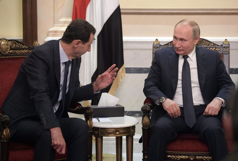 Russian President Vladimir Putin and Syrian President Bashar al-Assad hold a meeting in Damascus on January 7, 2020. Putin met his Syrian counterpart Bashar al-Assad during an unprecedented visit to Damascus as the prospect of war between Iran and the United States loomed over the region. / AFP / SPUTNIK / Alexey DRUZHININ
