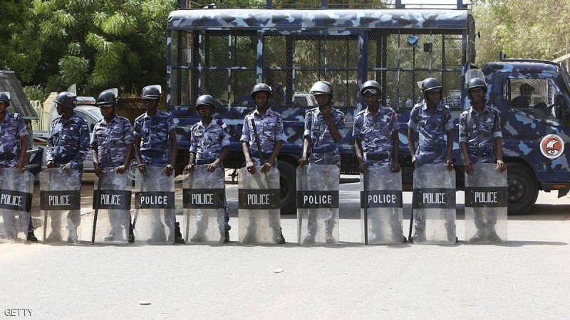 Sudanese police stand guard as hundreds of Sudanese Islamists demonstrate outside a United Nations office in central Khartoum on May 22, 2015, to protest the death sentence handed out to Egypt's ousted president Mohamed Morsi and dozens of other co-defendants by a court in Cairo on May 16. Morsi was among more than 100 defendants ordered by an Egyptian court to face the death penalty for their role in a mass jailbreak during the 2011 uprising. AFP PHOTO / ASHRAF SHAZLY (Photo credit should read ASHRAF SHAZLY/AFP/Getty Images)