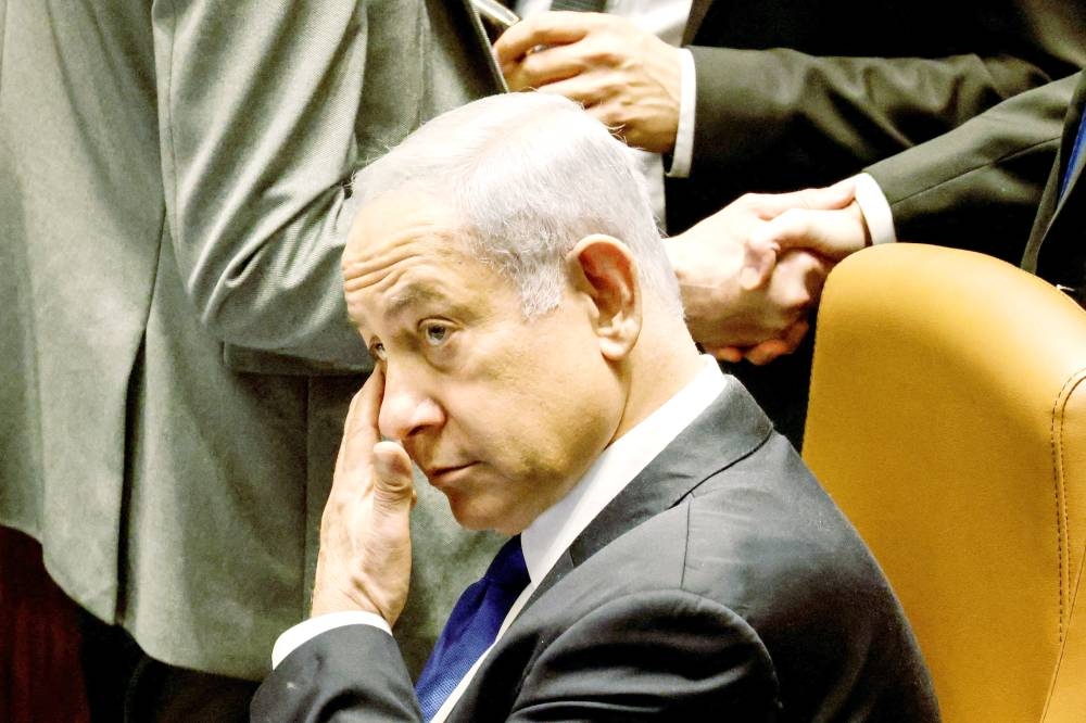 FILE PHOTO: Israeli Prime Minister Banjamin Netanyahu looks on as Israeli lawmakers vote on a bill that would limit some Supreme Court power, in the Knesset plenum in Jerusalem July 24, 2023. REUTERS/Amir Cohen/File Photo